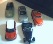 Lote com 5 replicas miniaturas carros, escala 1.32, 36, 37, 38, 39.marca maisto
