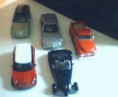 Lote com 5 replicas miniaturas carros, escala 1.32, 36, 37, 38, 39.marca maisto